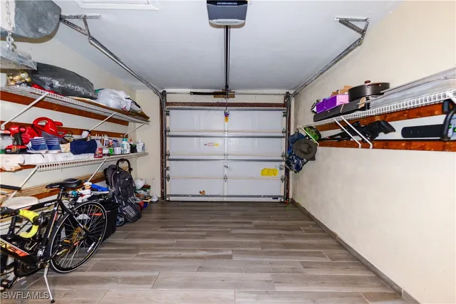 a dining room with furniture and garden view