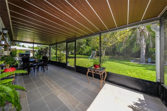 a view of a park with large trees