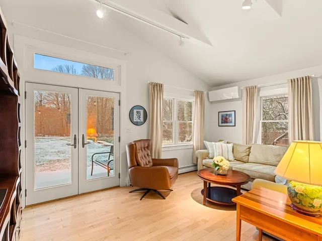 a living room with furniture and a table