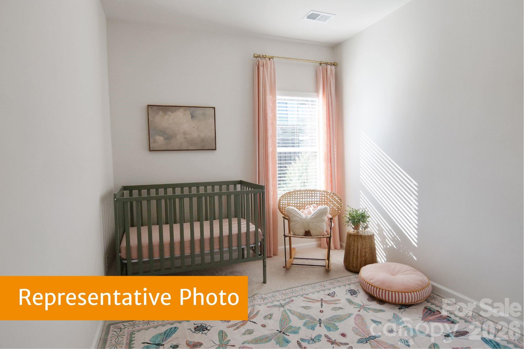 5613 Ringneck Road Charlotte, NC 28216 - Photo 20 of 29 a bedroom with a bed and window