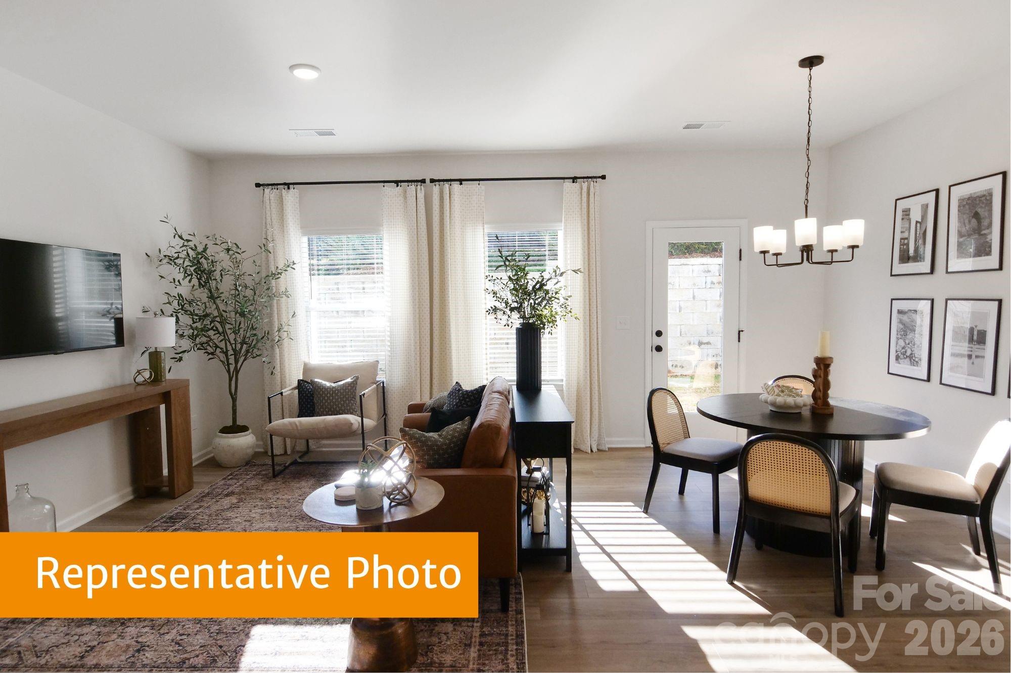 5613 Ringneck Road Charlotte, NC 28216 - Photo 8 of 29 a view of a livingroom with furniture window and wooden floor