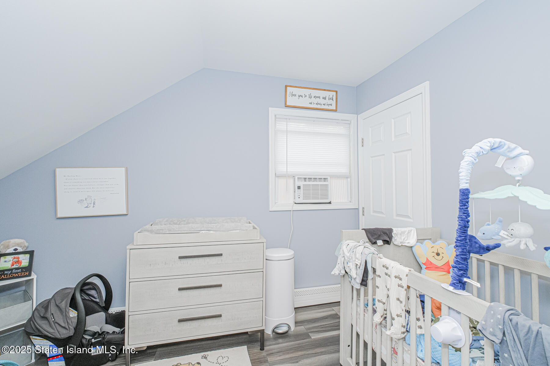 537 Annadale Road Staten Island, NY 10312 - Photo 12 of 27 a room with a baby crib closet and a window