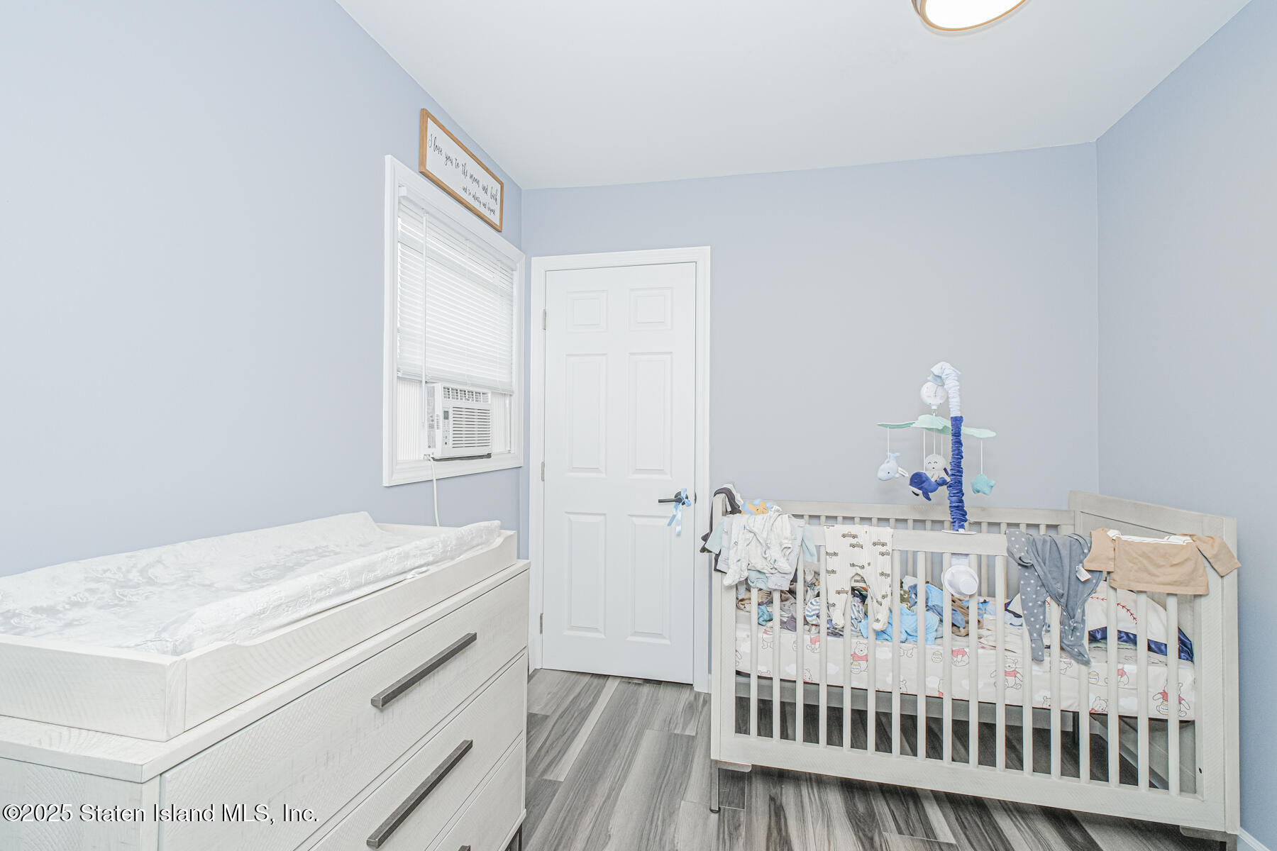 537 Annadale Road Staten Island, NY 10312 - Photo 13 of 27 a bedroom with a bed and a window