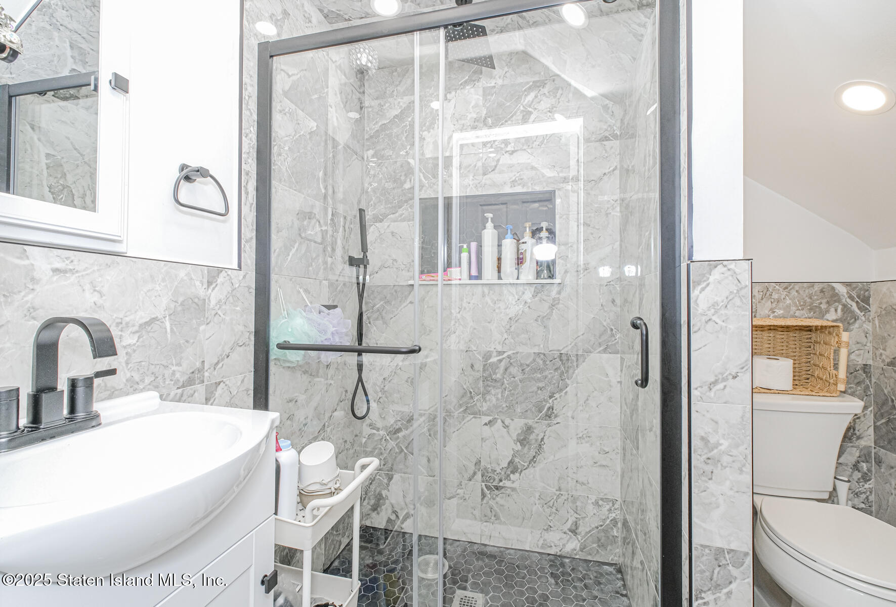 537 Annadale Road Staten Island, NY 10312 - Photo 17 of 27 a bathroom with a bathtub and shower