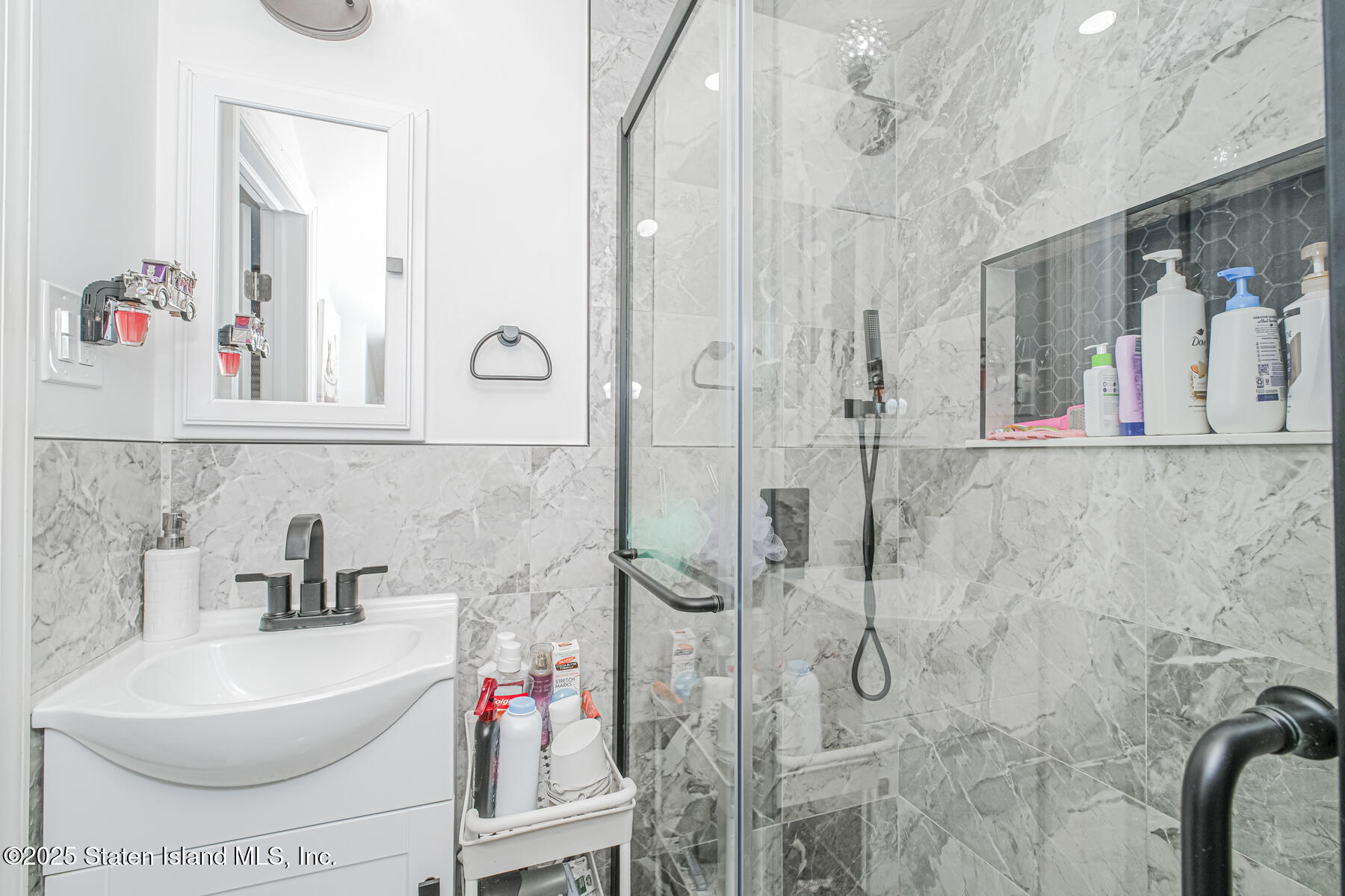 537 Annadale Road Staten Island, NY 10312 - Photo 18 of 27 a bathroom with a bathtub and a shower