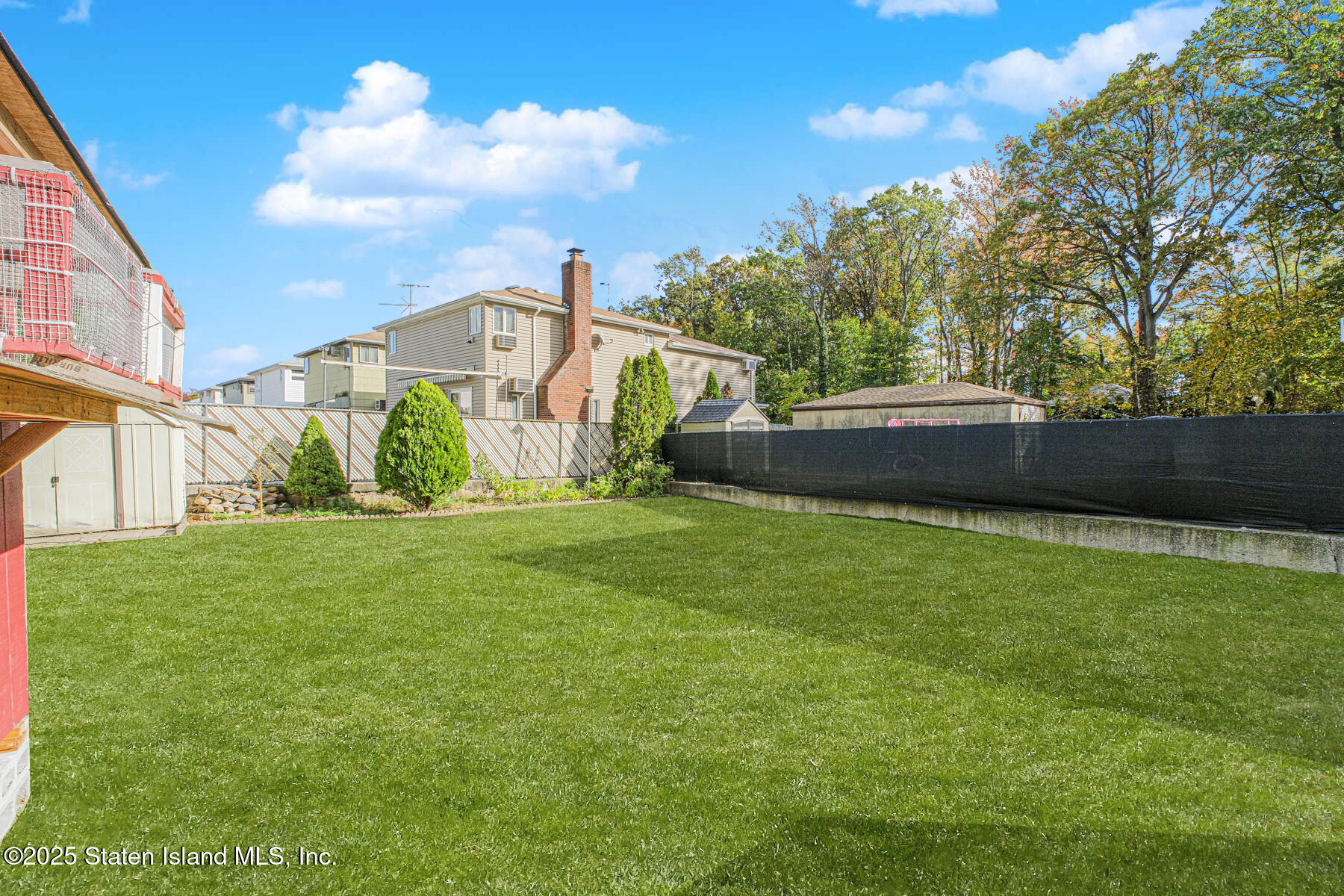 537 Annadale Road Staten Island, NY 10312 - Photo 24 of 27 a front view of a house with garden