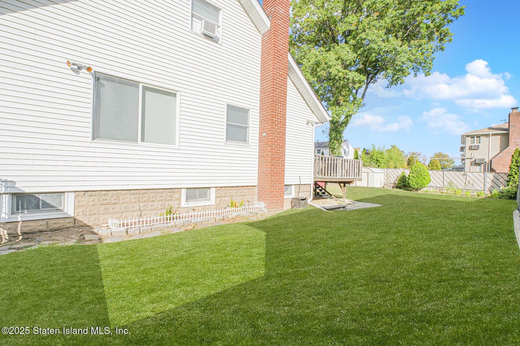 537 Annadale Road Staten Island, NY 10312 - Photo 25 of 27 a view of backyard with a garden and deck
