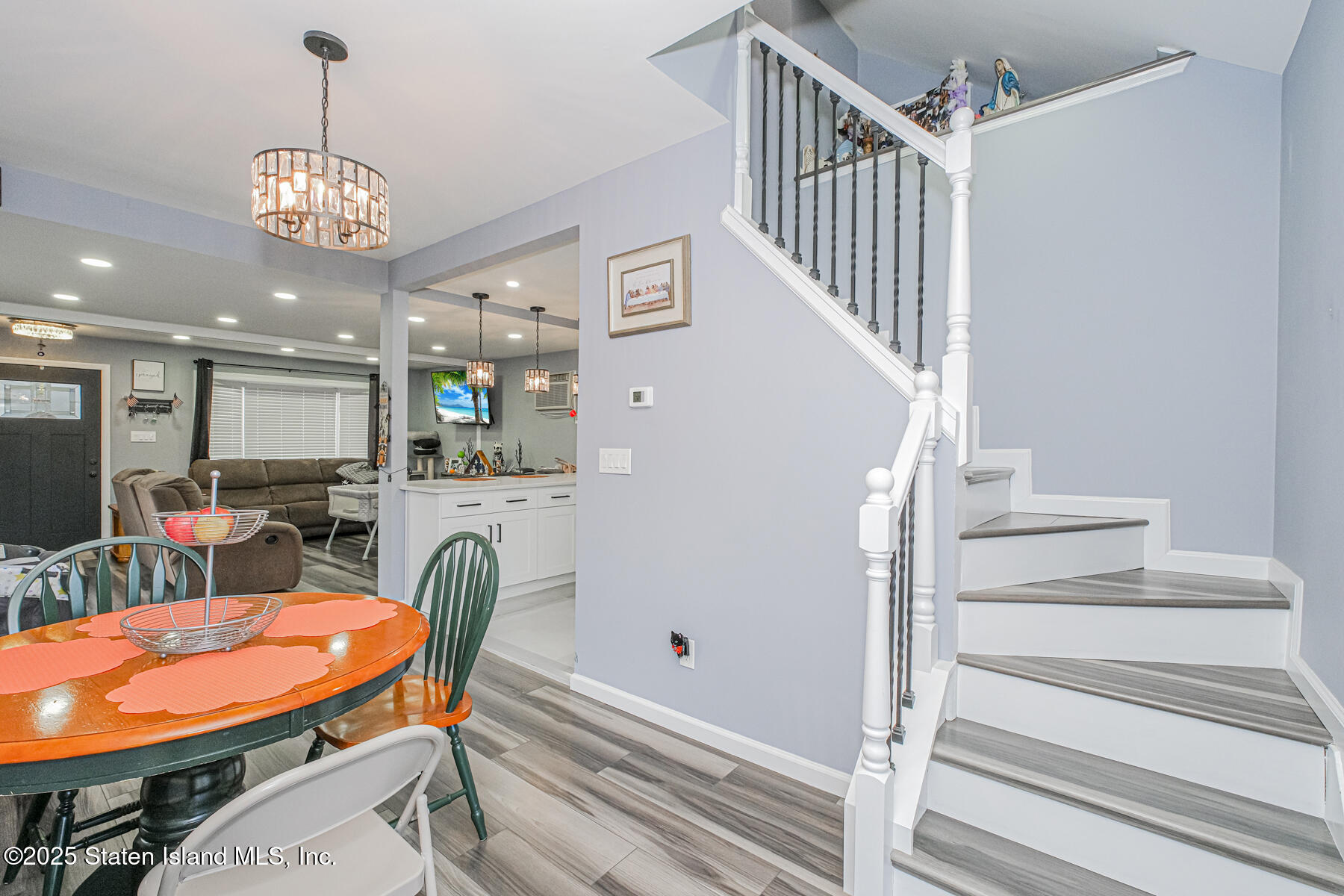 537 Annadale Road Staten Island, NY 10312 - Photo 4 of 27 a dining room with furniture entryway and wooden floor