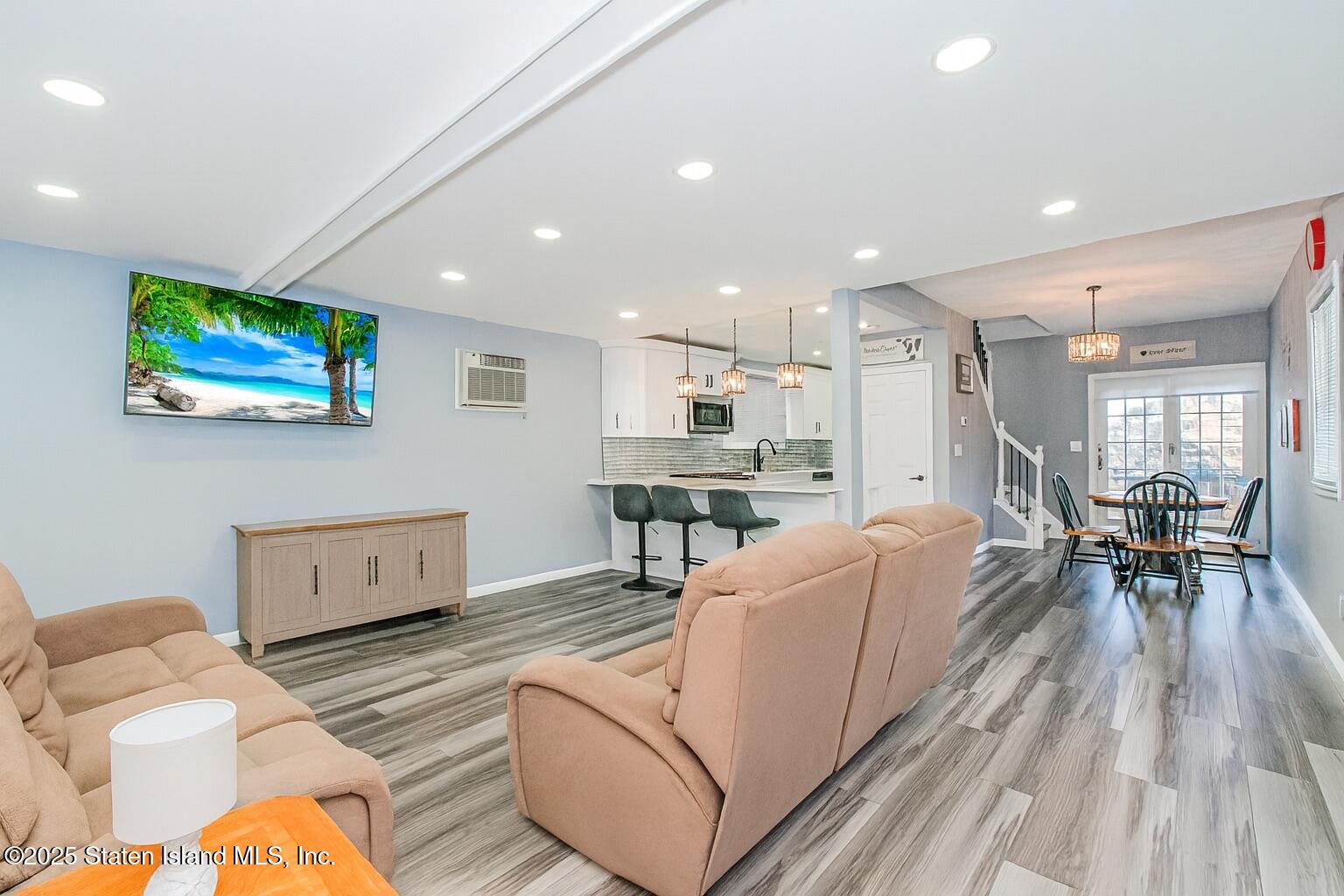 537 Annadale Road Staten Island, NY 10312 - Photo 7 of 27 a living room with furniture and a wooden floor