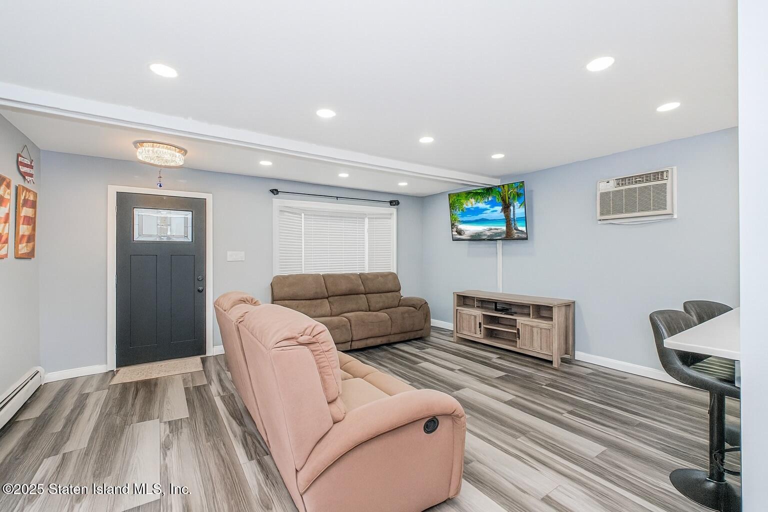 537 Annadale Road Staten Island, NY 10312 - Photo 8 of 27 a living room with furniture and a wooden floor