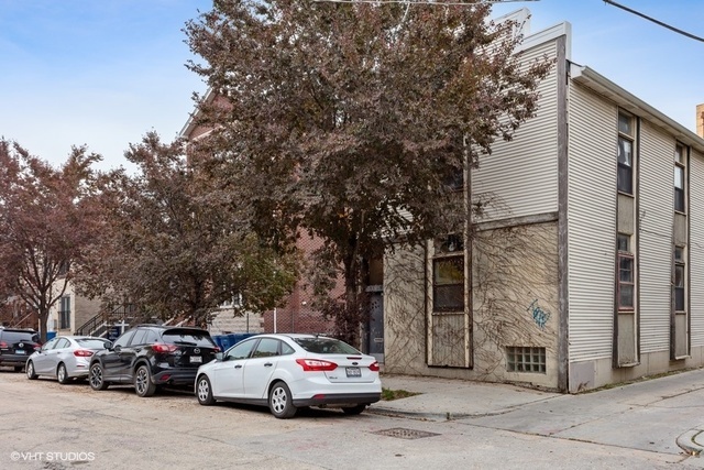 1723 South Jefferson Street, Unit 1R Chicago, IL 60616 - Photo 1 of 1 a car parked in front of a building