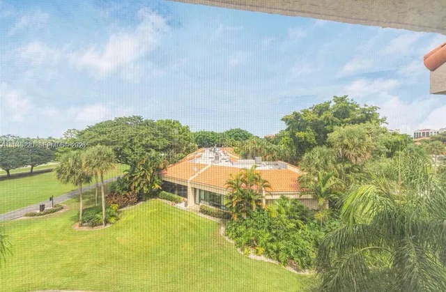 a view of a swimming pool with a yard