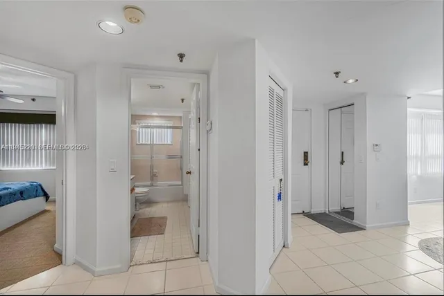 a bathroom with a shower and a sink