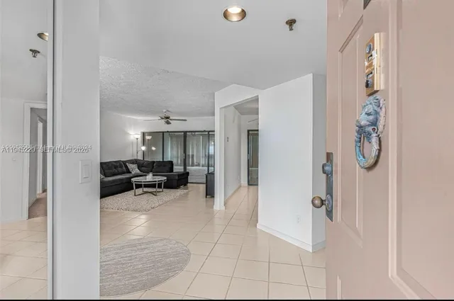 a view of living room filled with furniture and white walls