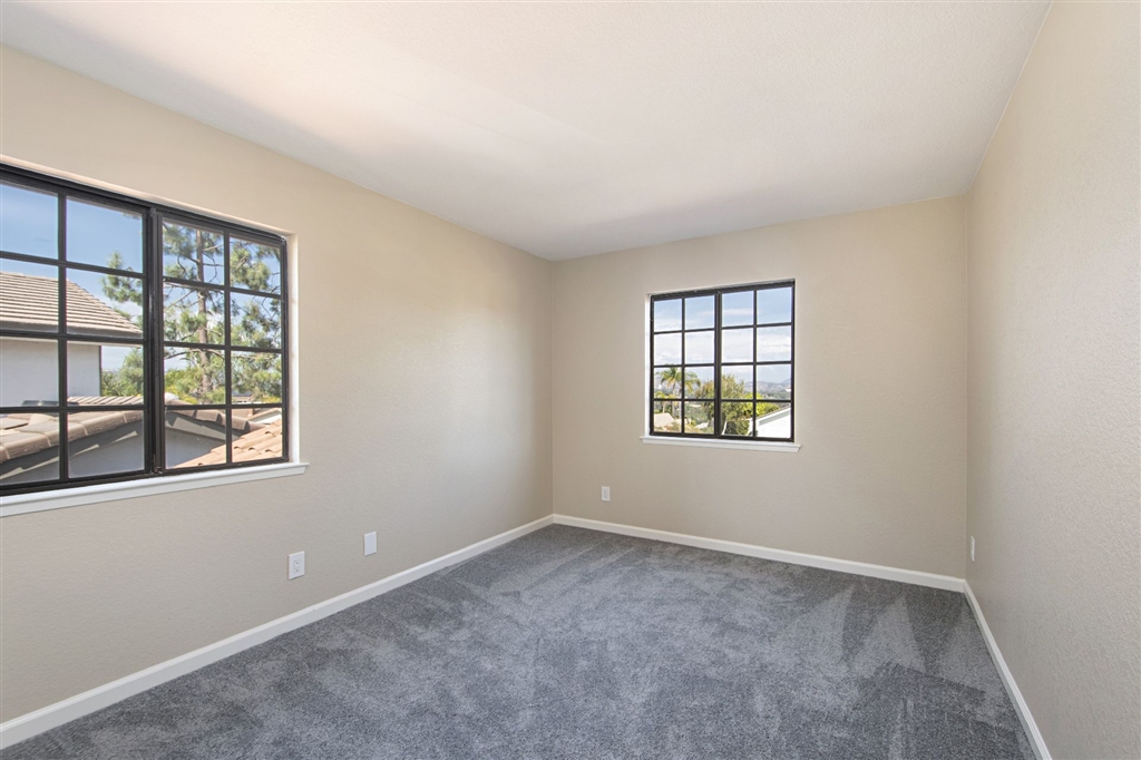 266 Sierra Ridge Drive Encinitas, CA 92024 - Photo 19 of 24 2nd bedroom with view to Olivenhain valleys and mountains