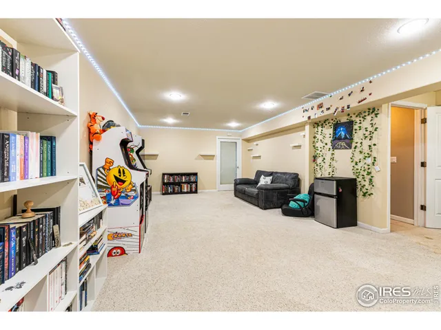 a bed room with a bed mirror and a window