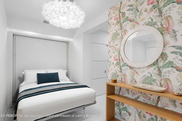 a bedroom with a bed and a mirror