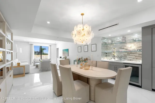 a view of a dining room with furniture wooden floor and chandelier