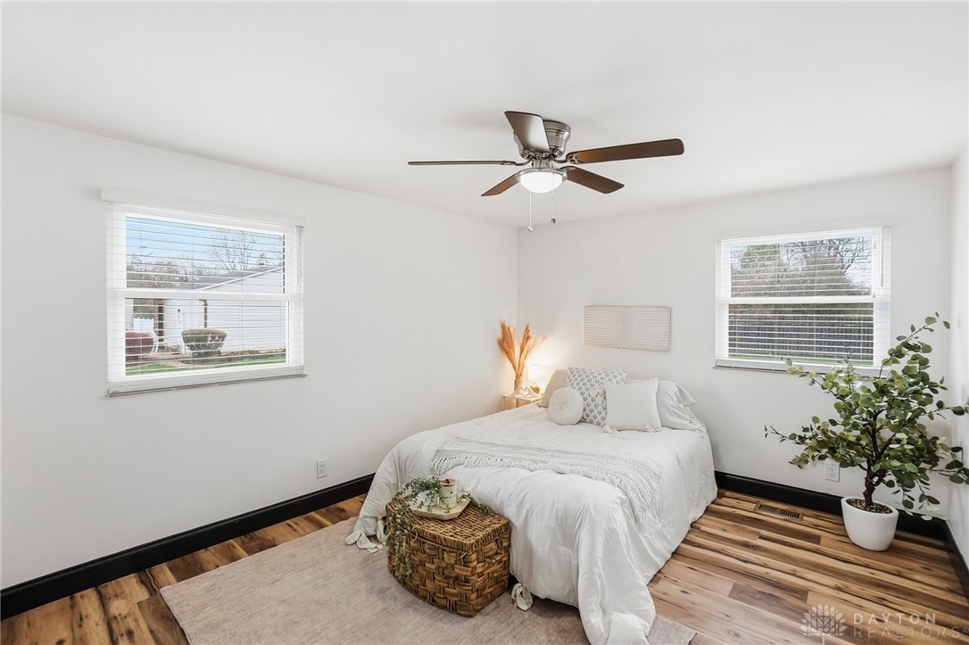 1628 Yorkshire Court Springfield, OH 45503 - Photo 21 of 47 This tranquil bedroom features abundant natural light and warm wood-look flooring.