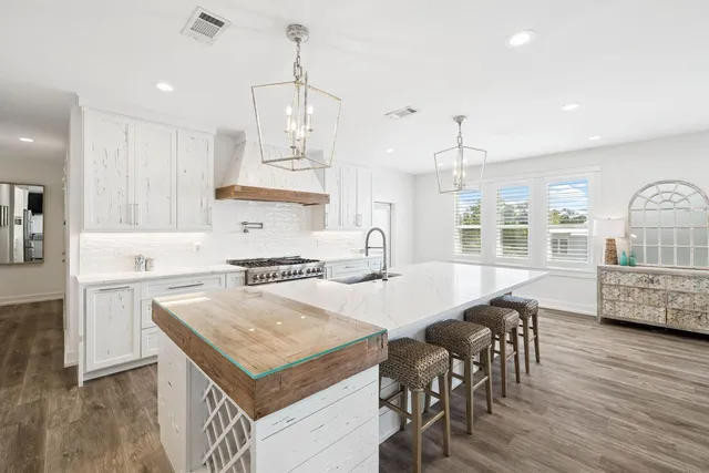 a kitchen with a stove and a sink