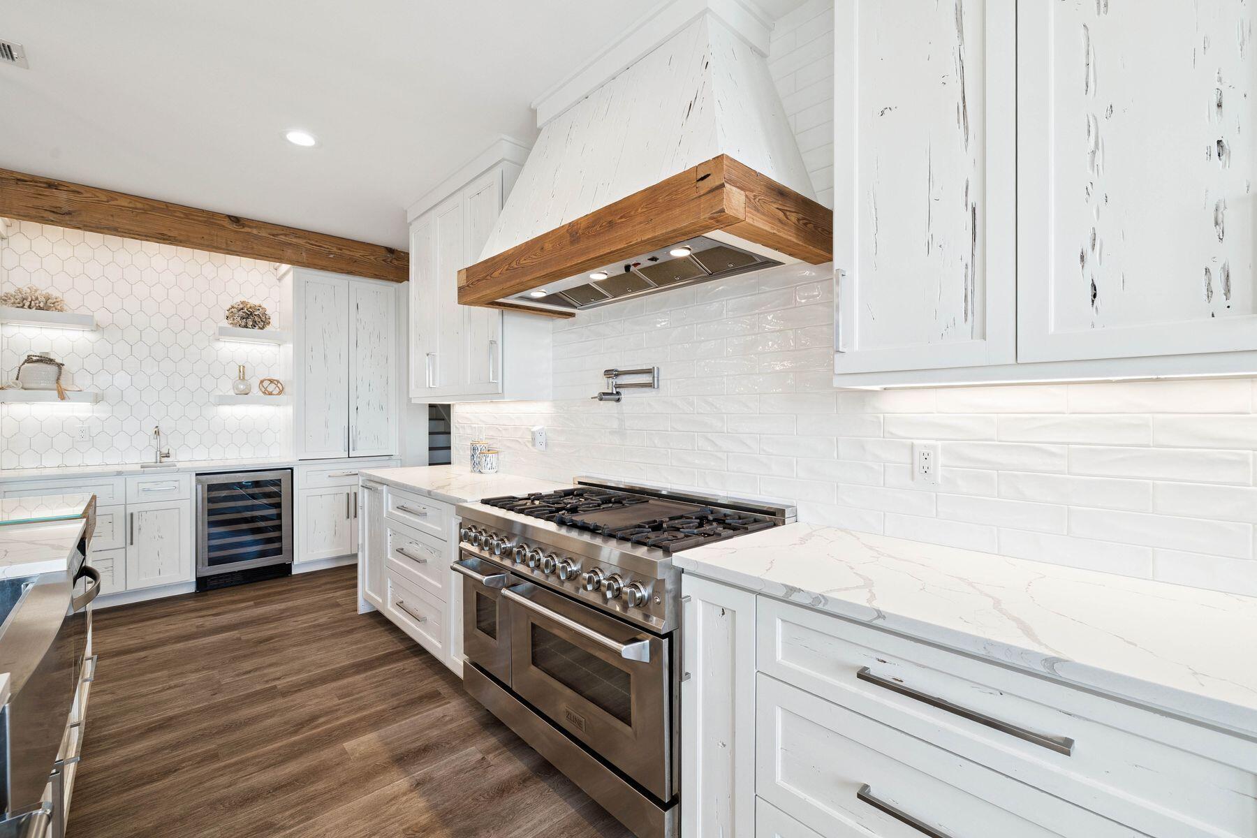 1984 South Co Highway 83 Santa Rosa Beach, FL 32459 - Photo 27 of 70 a kitchen with stainless steel appliances white cabinets and a stove