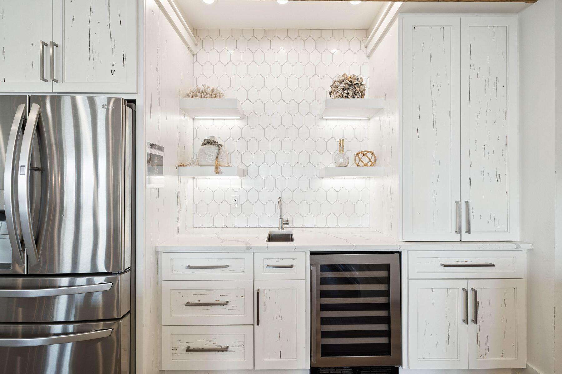 1984 South Co Highway 83 Santa Rosa Beach, FL 32459 - Photo 29 of 70 a kitchen with cabinets and stainless steel appliances