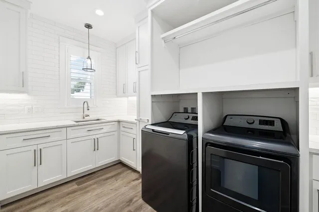 a living room with furniture a flat screen tv and a window
