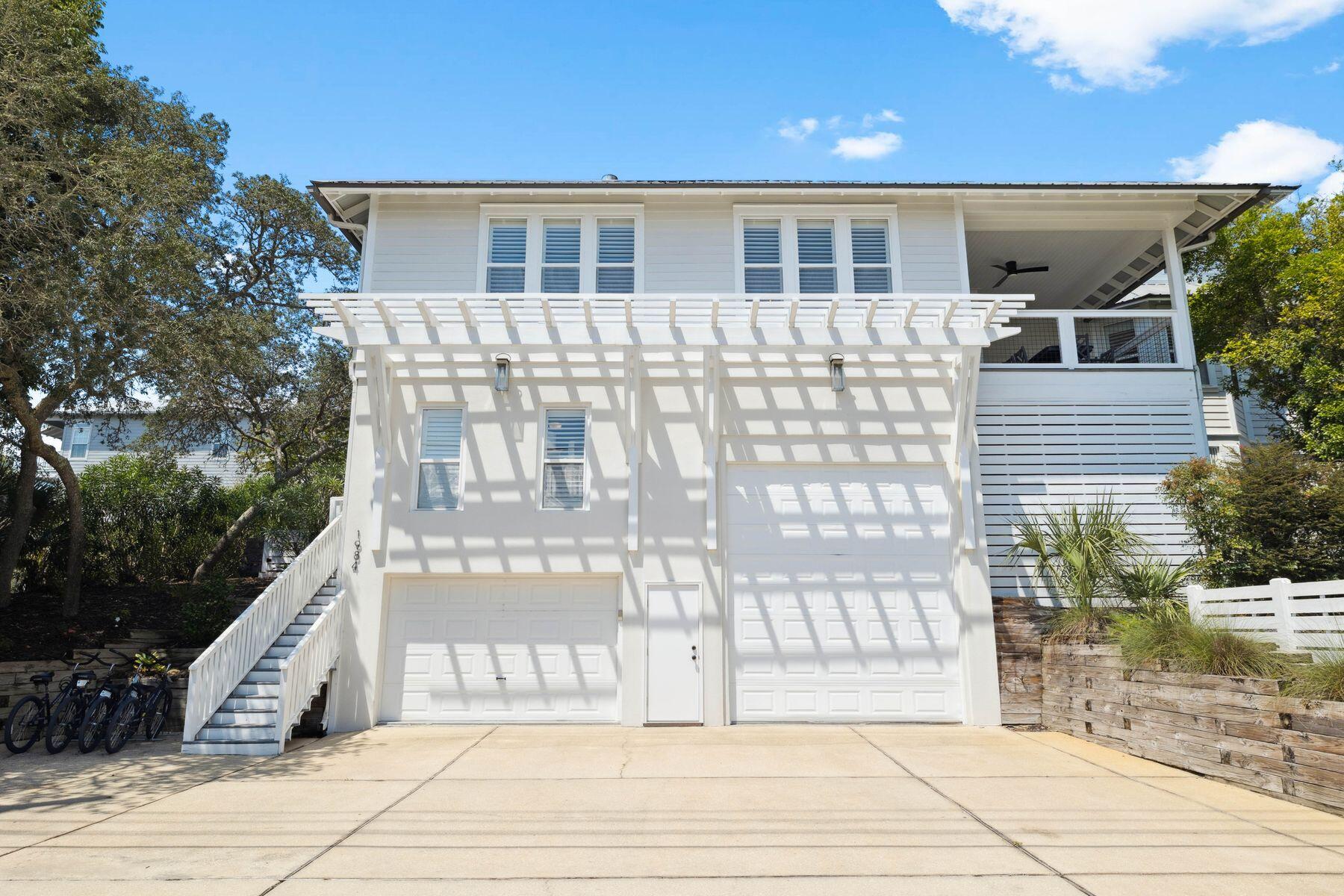 1984 South Co Highway 83 Santa Rosa Beach, FL 32459 - Photo 3 of 70 a front view of a house with a garden