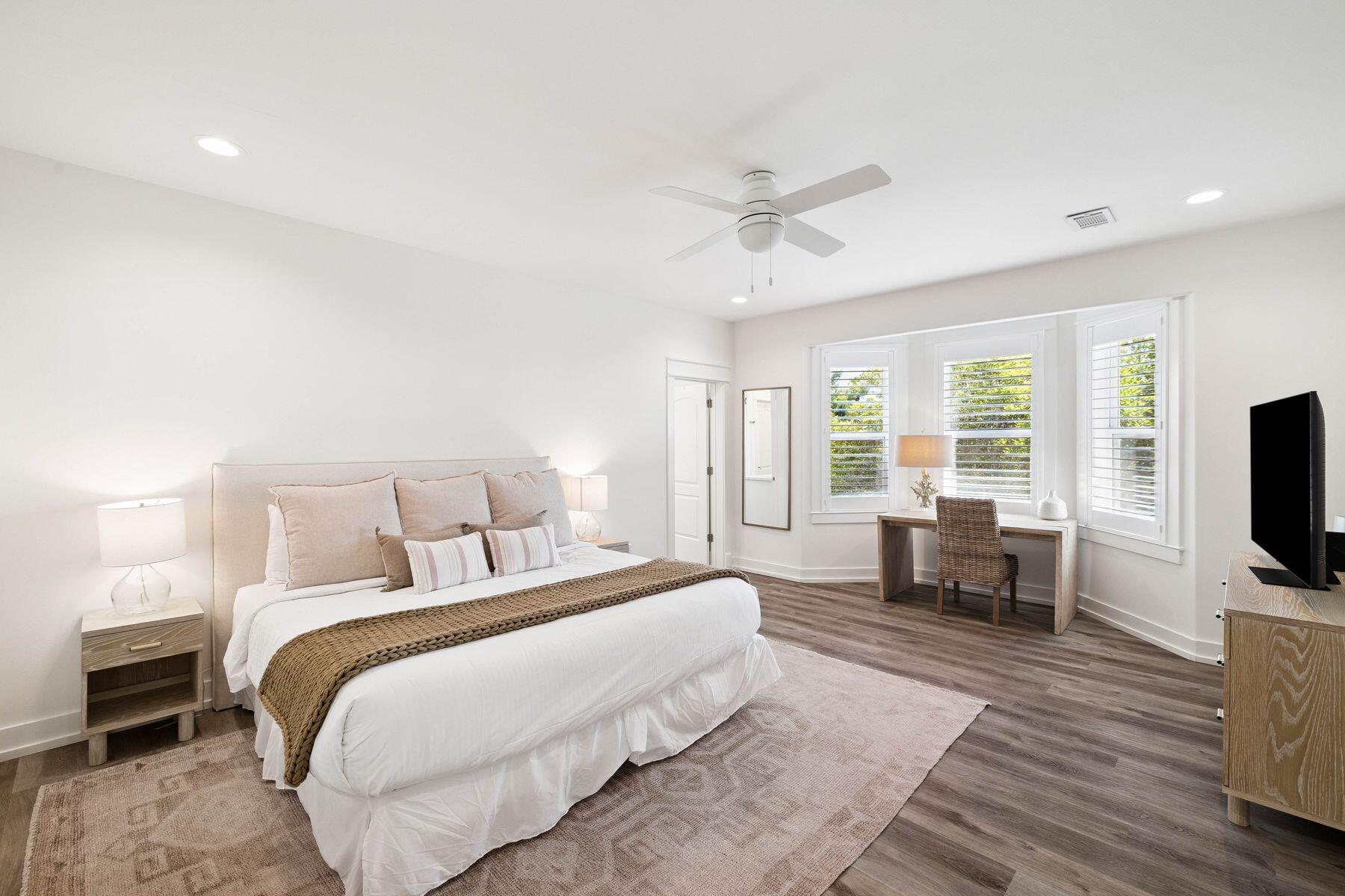1984 South Co Highway 83 Santa Rosa Beach, FL 32459 - Photo 33 of 70 a spacious bedroom with a bed and a flat screen tv