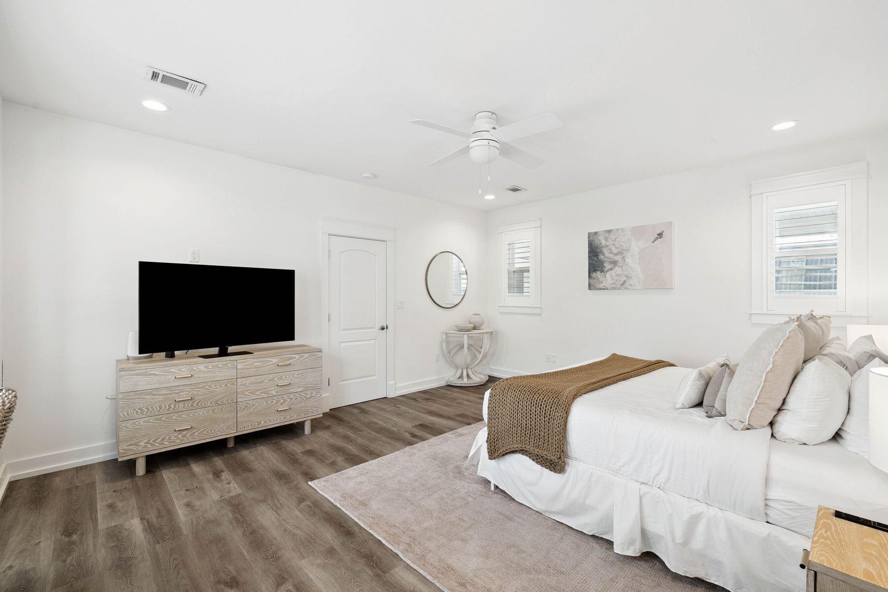 1984 South Co Highway 83 Santa Rosa Beach, FL 32459 - Photo 35 of 70 a spacious bedroom with a bed and a flat screen tv