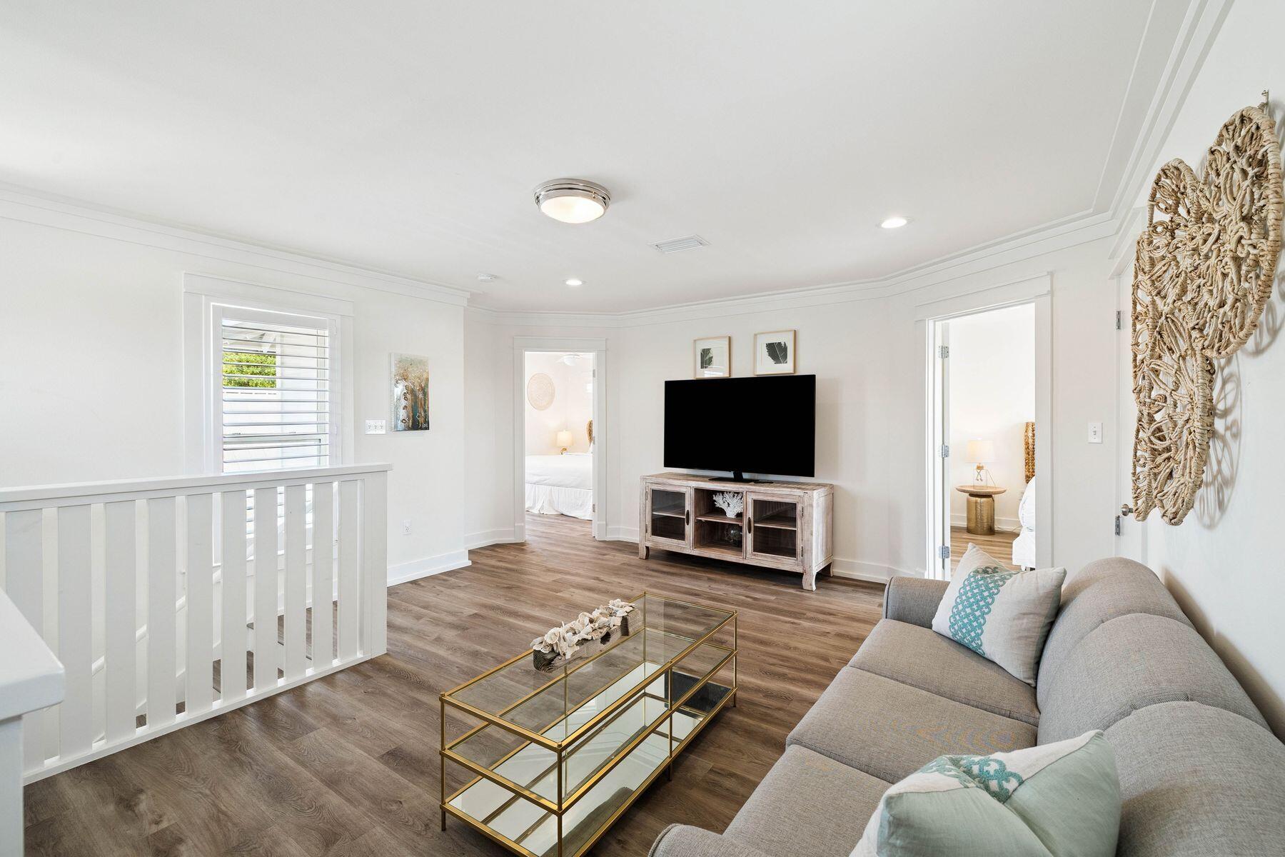 1984 South Co Highway 83 Santa Rosa Beach, FL 32459 - Photo 41 of 70 a living room with furniture a flat screen tv and a window