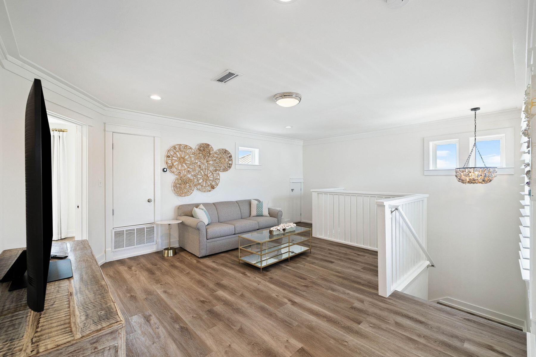 1984 South Co Highway 83 Santa Rosa Beach, FL 32459 - Photo 42 of 70 a living room with furniture and wooden floor
