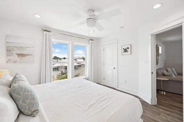 a living room with furniture a wooden floor and a table