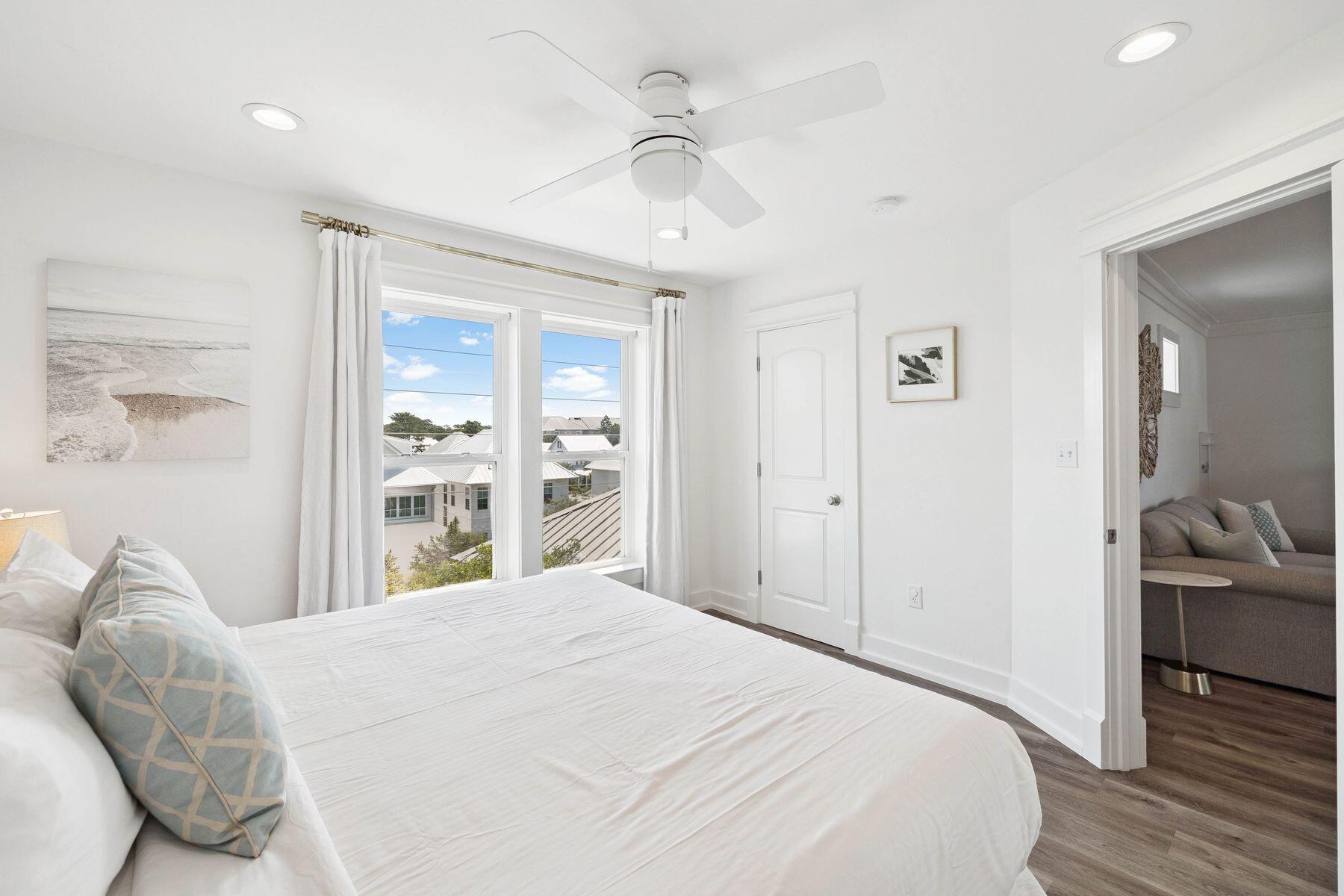 1984 South Co Highway 83 Santa Rosa Beach, FL 32459 - Photo 44 of 70 a bedroom with a large bed and a chandelier