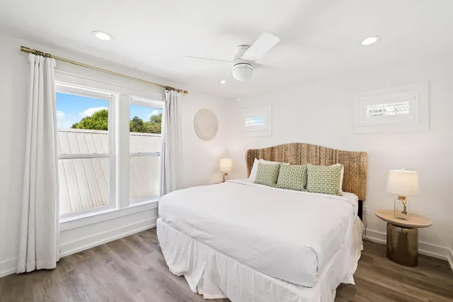 a bedroom with two beds and a flat screen tv