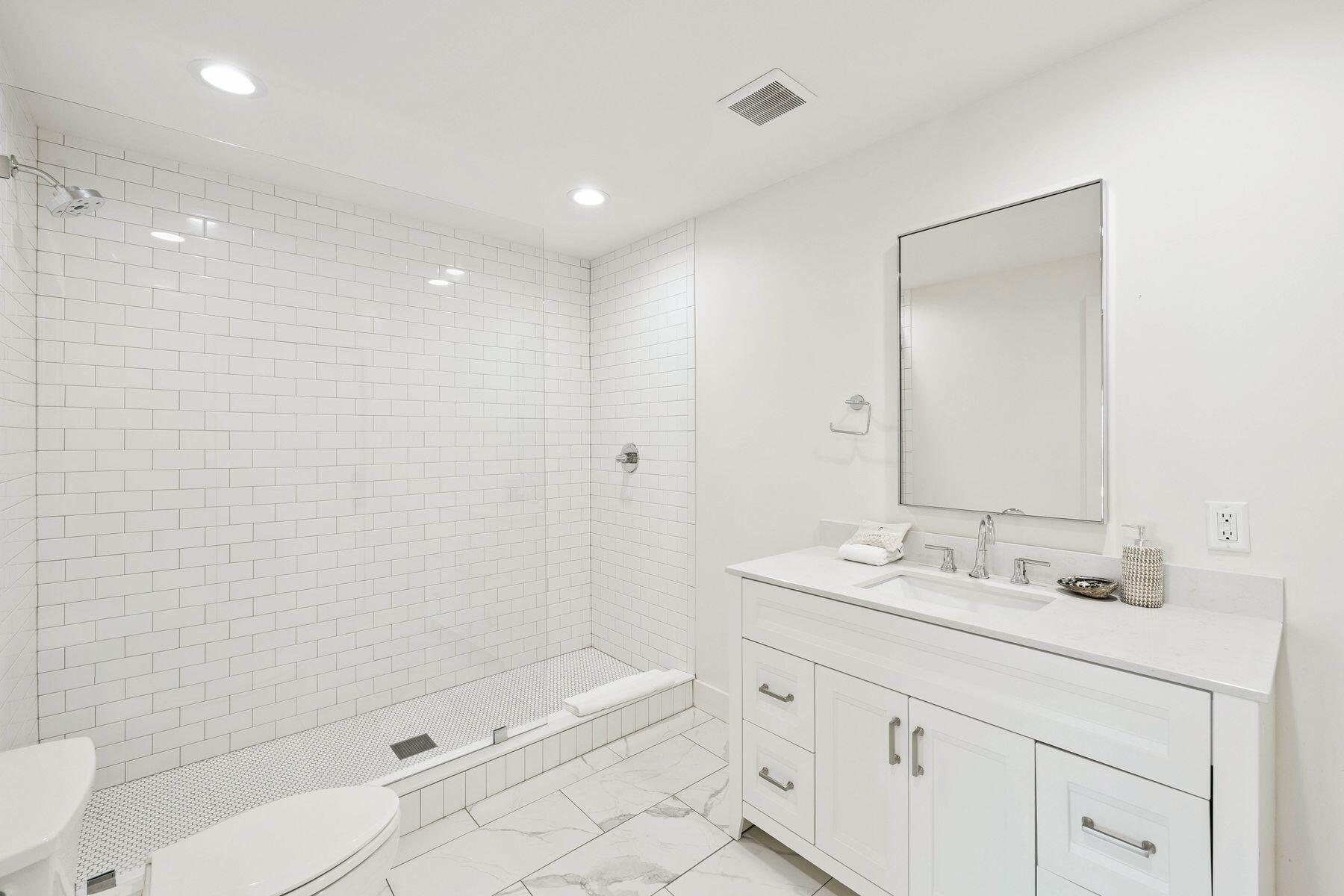 1984 South Co Highway 83 Santa Rosa Beach, FL 32459 - Photo 52 of 70 a bathroom with a sink a toilet and shower