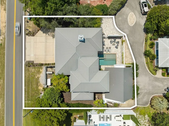 a view of a patio with table and chairs and potted plants