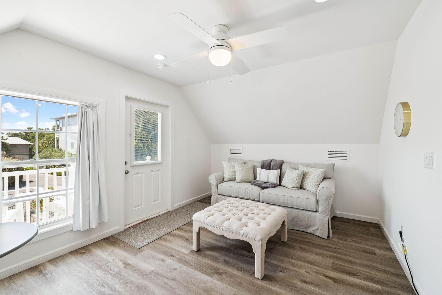 1984 South Co Highway 83 Santa Rosa Beach, FL 32459 - Photo 62 of 70 a living room with furniture a wooden floor and a table