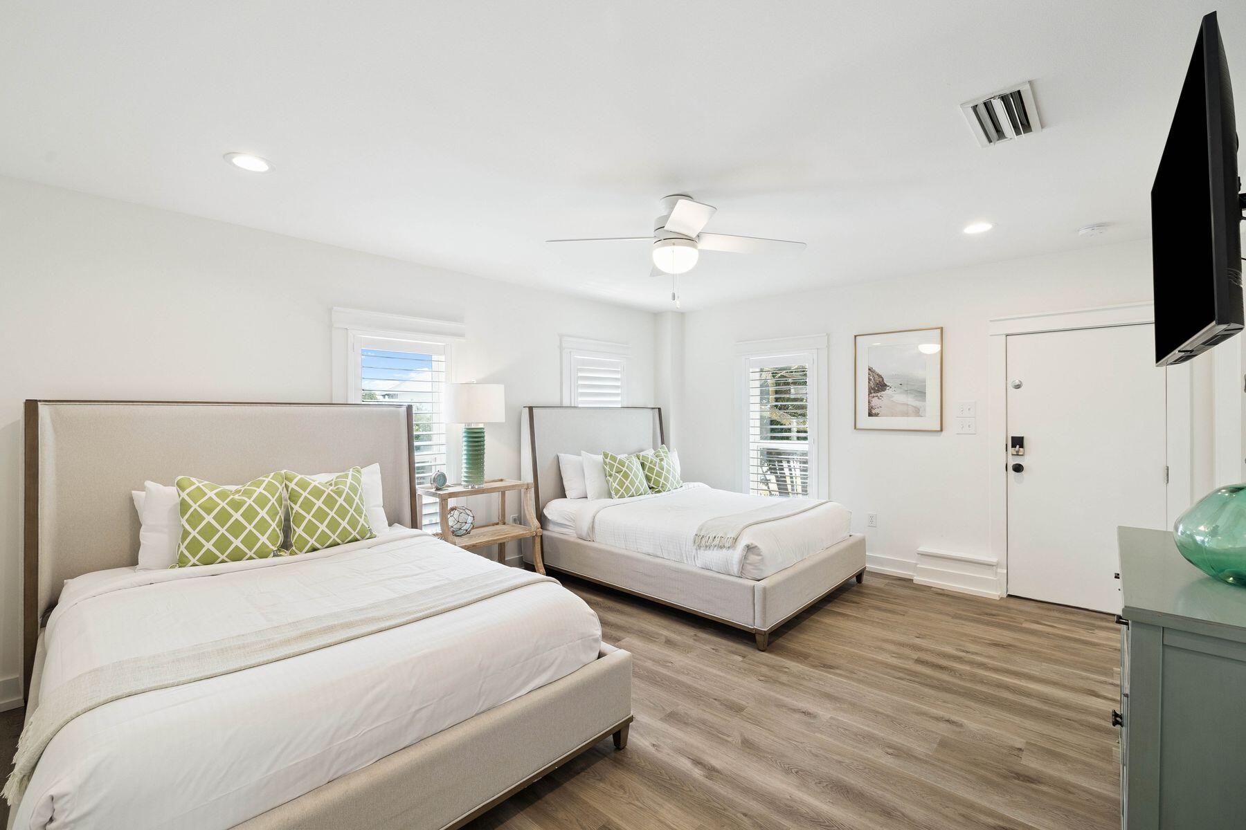 1984 South Co Highway 83 Santa Rosa Beach, FL 32459 - Photo 66 of 70 a bedroom with two beds and a flat screen tv