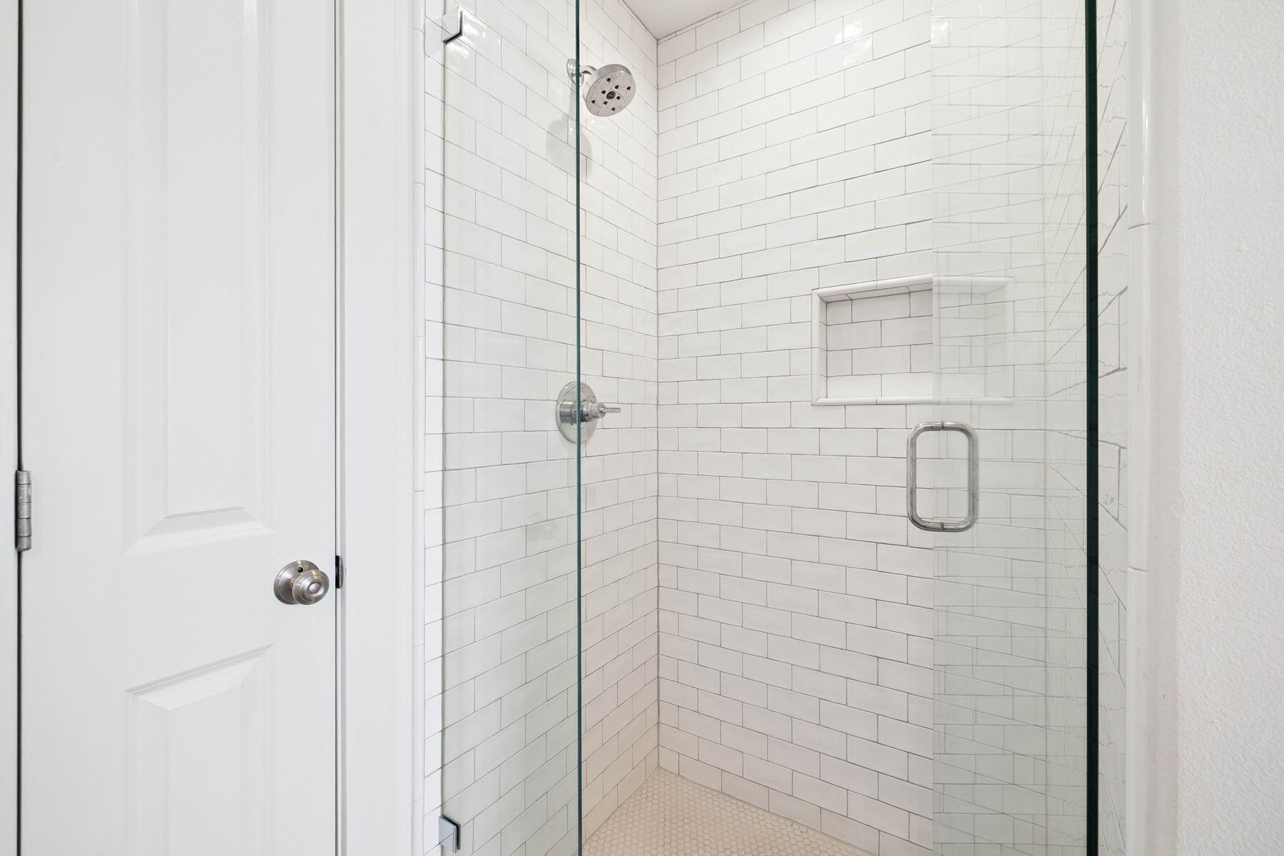 1984 South Co Highway 83 Santa Rosa Beach, FL 32459 - Photo 68 of 70 a bathroom with a glass shower door