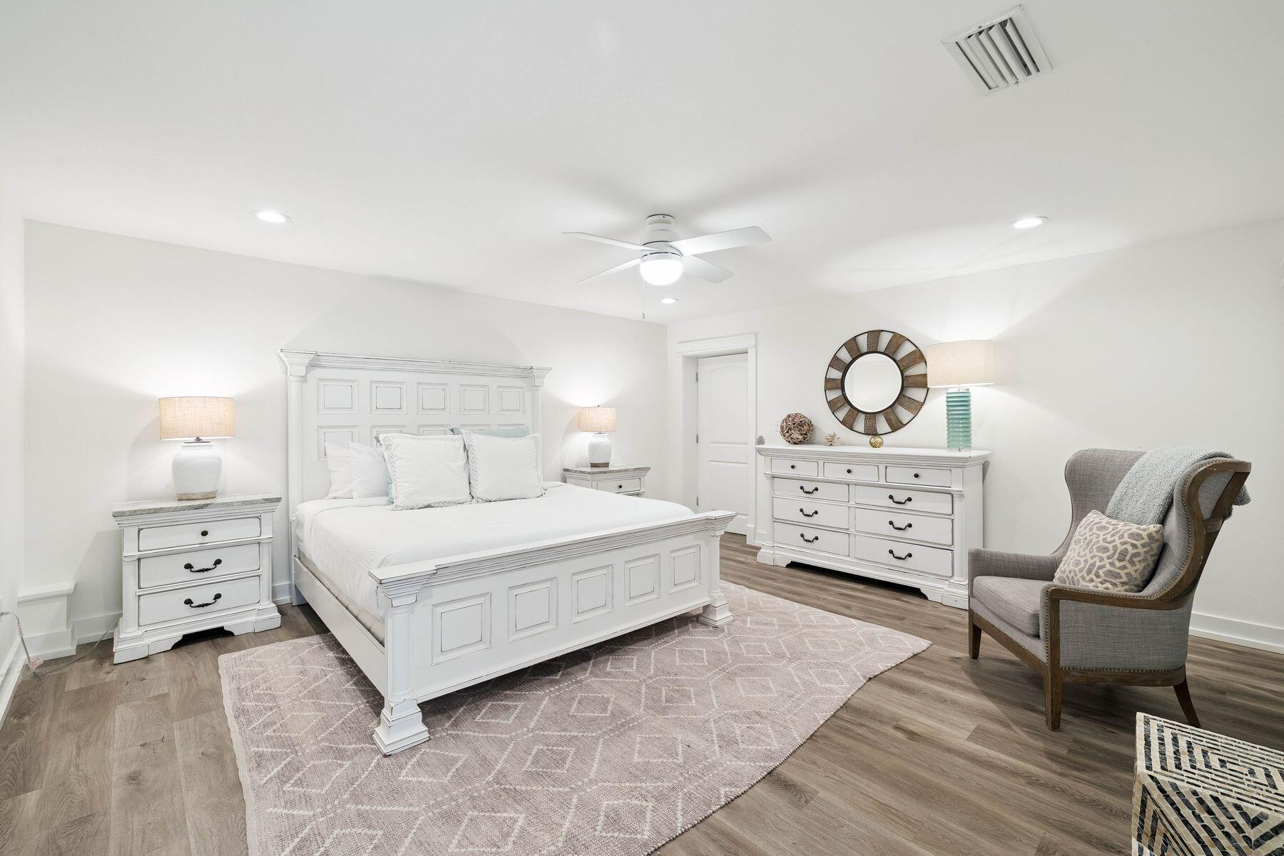 1984 South Co Highway 83 Santa Rosa Beach, FL 32459 - Photo 69 of 70 a bedroom with a bed a chair and dresser