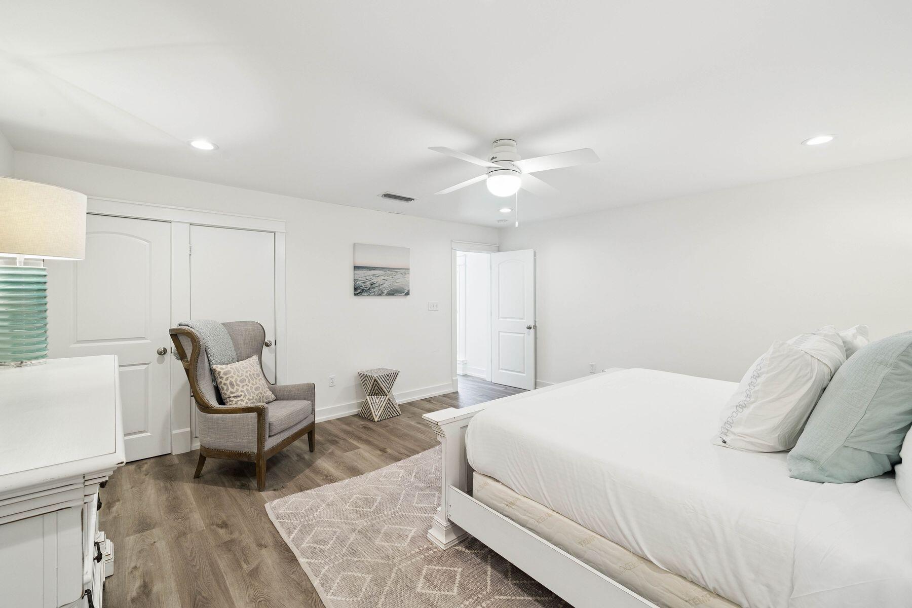 1984 South Co Highway 83 Santa Rosa Beach, FL 32459 - Photo 70 of 70 a bedroom with a bed a chair and glass door