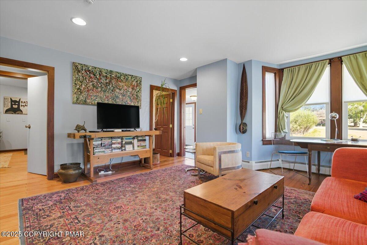 221 Upper Swiftwater Road Mount Pocono, PA 18344 - Photo 12 of 86 a living room with furniture and a flat screen tv