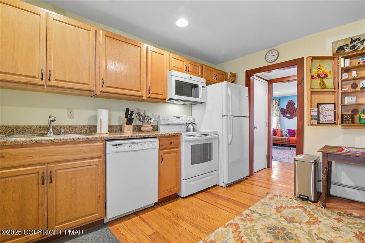 221 Upper Swiftwater Road Mount Pocono, PA 18344 - Photo 20 of 86 a kitchen with stainless steel appliances granite countertop a refrigerator sink and cabinets