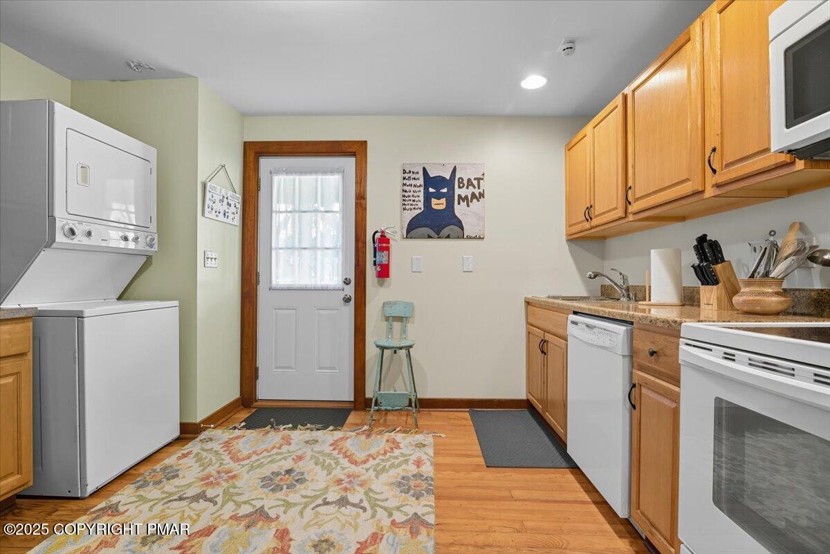 221 Upper Swiftwater Road Mount Pocono, PA 18344 - Photo 21 of 86 a kitchen with a refrigerator and cabinets