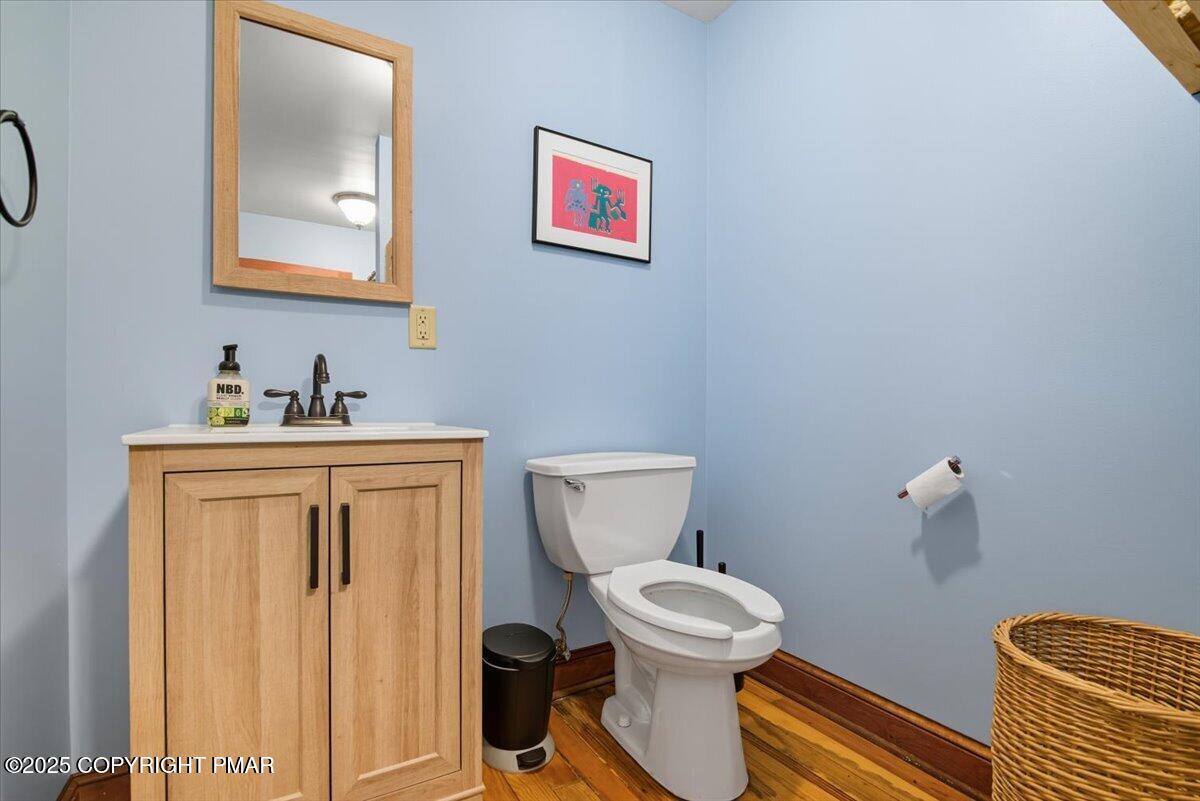 221 Upper Swiftwater Road Mount Pocono, PA 18344 - Photo 33 of 86 a bathroom with a toilet sink and mirror