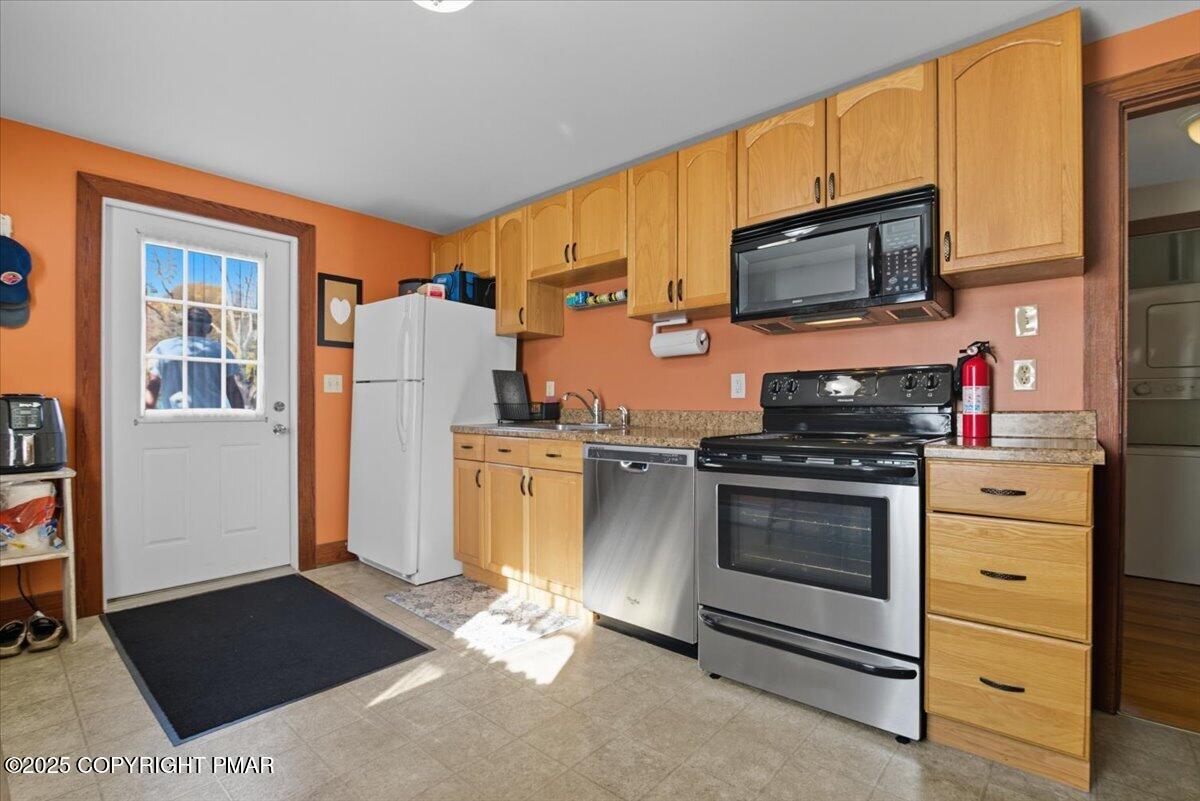 221 Upper Swiftwater Road Mount Pocono, PA 18344 - Photo 42 of 86 a kitchen with stainless steel appliances kitchen island granite countertop a refrigerator stove and sink