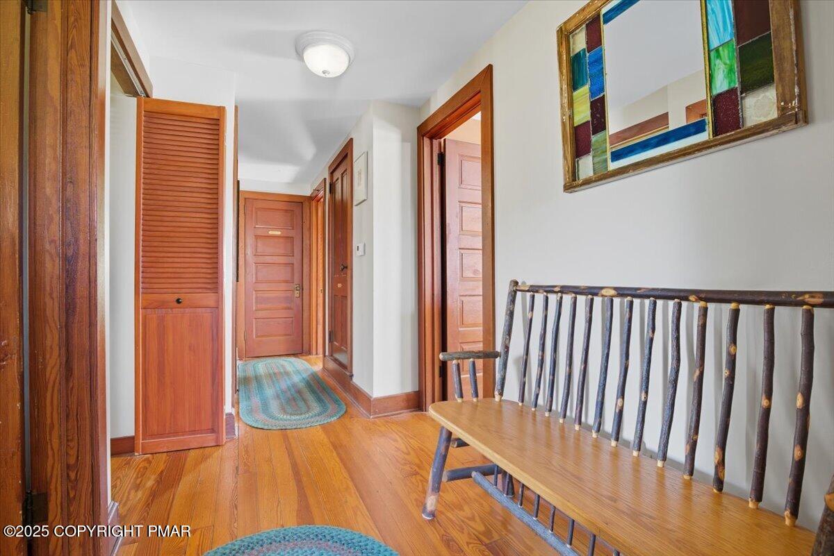 221 Upper Swiftwater Road Mount Pocono, PA 18344 - Photo 45 of 86 a view of a bedroom with wooden floor and windows