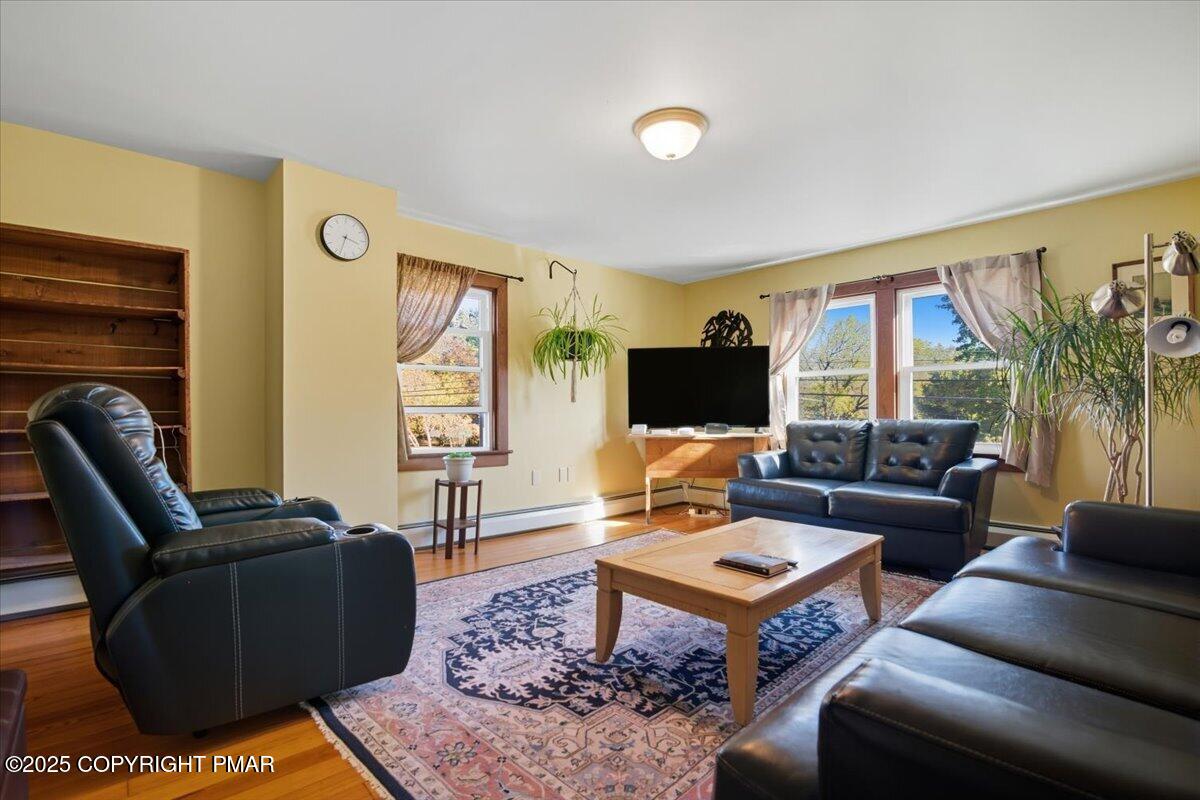 221 Upper Swiftwater Road Mount Pocono, PA 18344 - Photo 46 of 86 a living room with furniture a rug and a flat screen tv