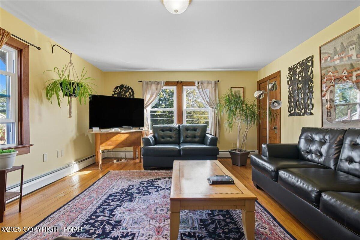 221 Upper Swiftwater Road Mount Pocono, PA 18344 - Photo 47 of 86 a living room with furniture tv and a flat screen tv